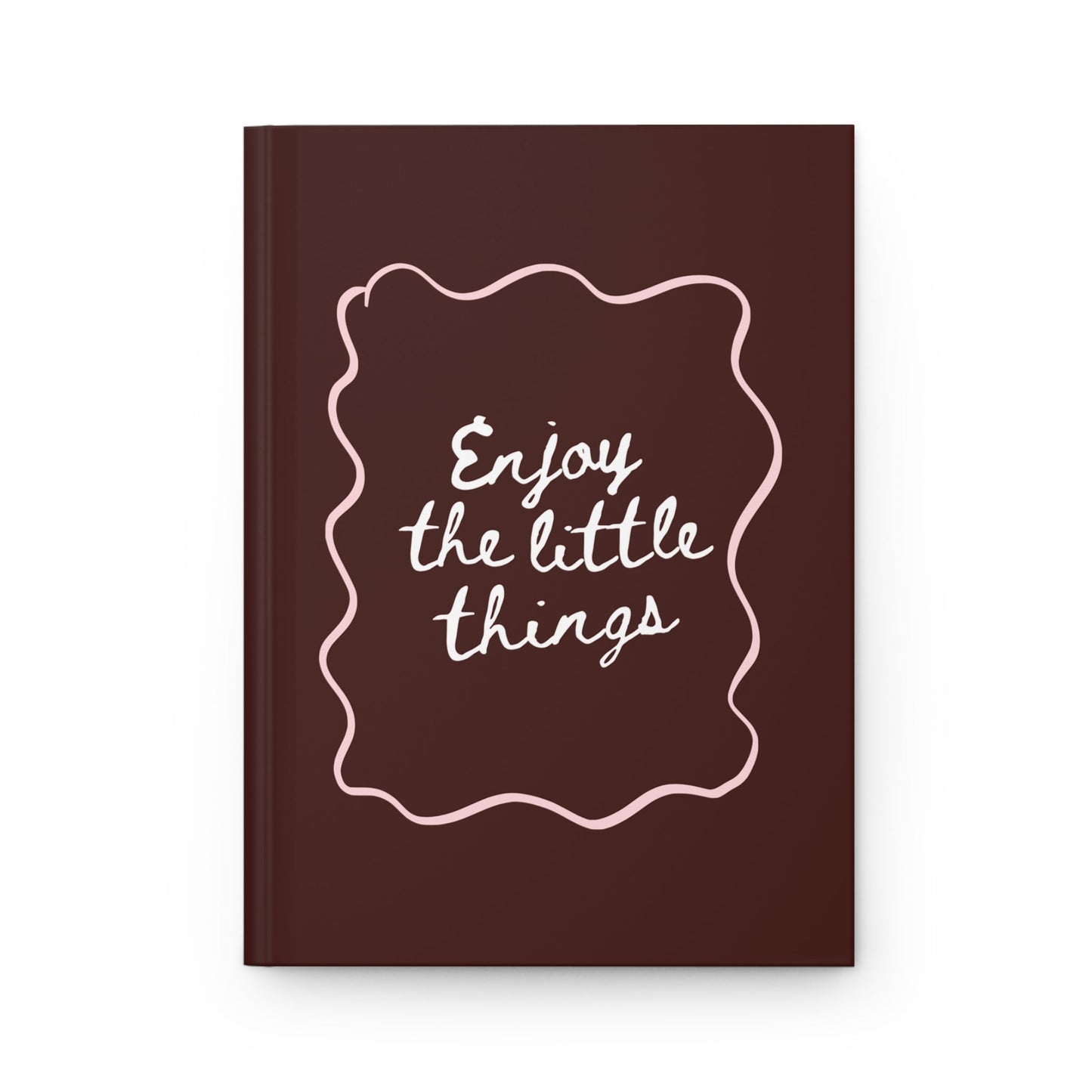 brown aesthetic journal with “enjoy the little things” handwritten quote