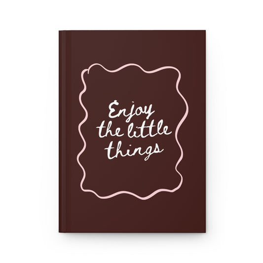brown aesthetic journal with “enjoy the little things” handwritten quote